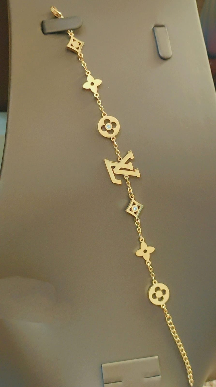 Tory Burch and Lv bracelet